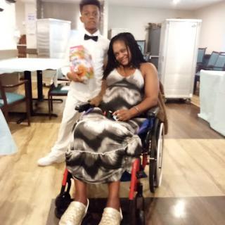 A beautiful moment shared between a mother and her son at a celebration.