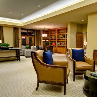 A modern living room with comfortable seating and elegant decor.