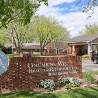 A health and rehabilitation facility with a brick sign and landscaped surroundings.