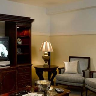 A cozy living room with a television and comfortable seating.