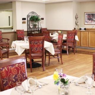 A cozy indoor dining area with neatly arranged tables and chairs.