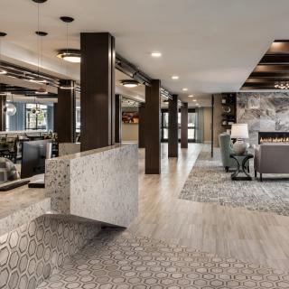A modern hotel lobby with stylish decor and comfortable seating.