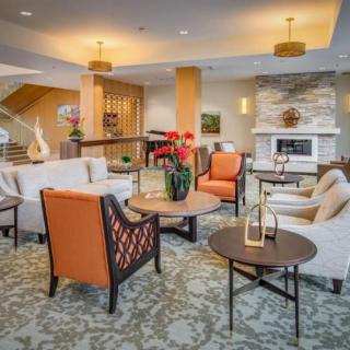 A cozy and elegantly designed living room with modern furniture and decor.