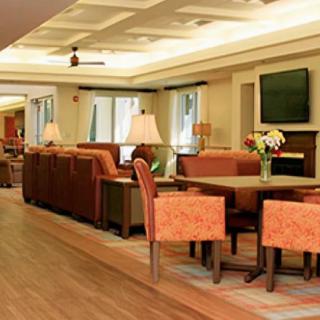 A cozy lounge area with comfortable seating and a television.