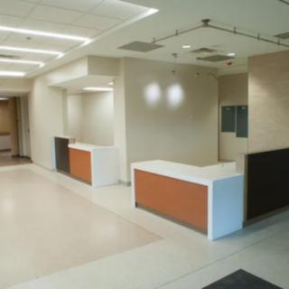 A modern and minimalist reception area in an office space.