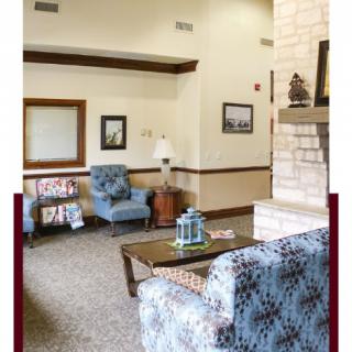 A cozy living room with comfortable seating and decorative elements.
