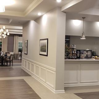 A modern open-concept interior with a dining area and kitchen.