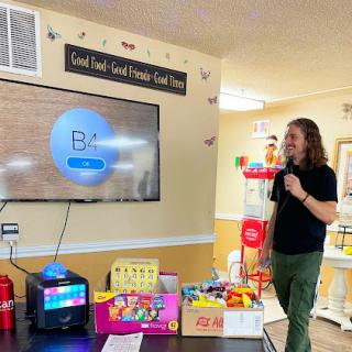 A lively bingo night in a community center, complete with games and colorful toys.