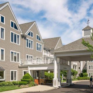 A modern residential building with a well-maintained exterior and clear skies above.