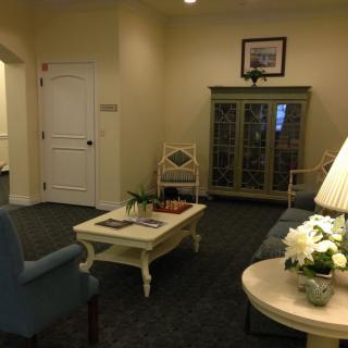A cozy living room interior with comfortable seating and elegant decor.