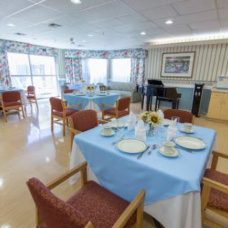 Bright and inviting dining area with neatly set tables.