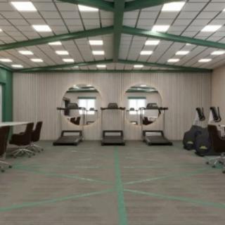A modern office space featuring treadmills integrated with desks for an active workspace.