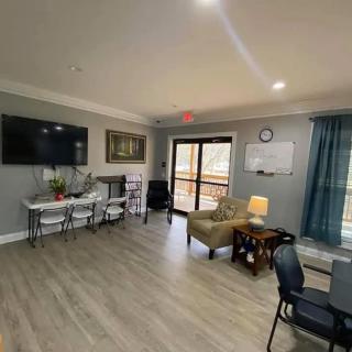 A cozy living room with modern furniture and decor.