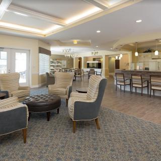 A modern lounge area with comfortable seating and ambient lighting.