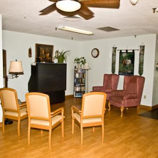 A cozy living room setup featuring comfortable seating and a TV.