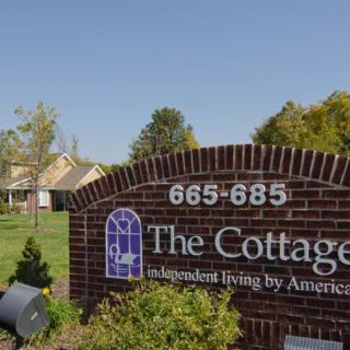 The entrance sign for The Cottage, an independent living community.