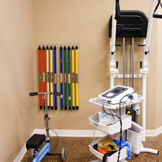 A well-equipped physical therapy space featuring a variety of exercise tools for rehabilitation.