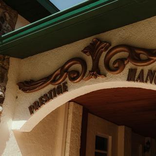 Decorative archway with ornate design elements on a building front.