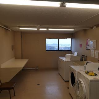 A clean and functional laundry room featuring washing and drying appliances with ample space.