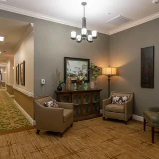 A cozy seating area in a warmly decorated hallway.