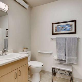 A clean and well-organized bathroom with modern amenities.