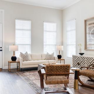 A modern living room with comfortable seating and stylish decor.