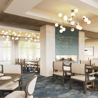 A modern and upscale restaurant dining area featuring elegant chandeliers and sophisticated interior design.