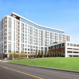 A modern urban apartment complex with a sleek design and spacious layout.