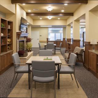 A modern dining area with comfortable seating and elegant lighting.