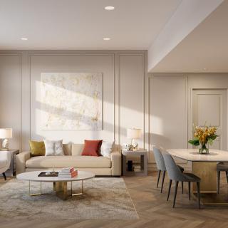 A modern living room with elegant furniture and warm lighting.