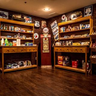 A nostalgic room filled with vintage collectibles and retro decor on wooden shelves.