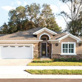 A suburban house with a neatly landscaped front yard.