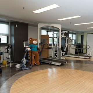 A fitness center with various exercise and medical equipment.