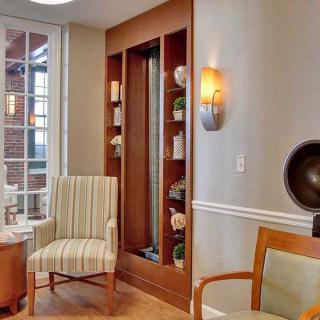 A cozy living room with elegant furniture and warm lighting.