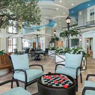A beautifully designed lobby featuring modern seating and lush greenery.