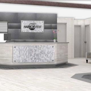 A modern office reception area with a sleek desk and stylish decor.
