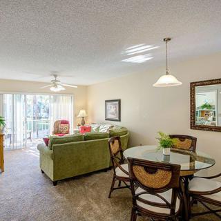 A cozy living and dining space with modern furniture and ample natural light.
