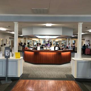 A spacious reception area with a welcoming desk and a modern design.