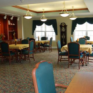 A cozy dining area featuring tables and chairs, perfect for social gatherings.