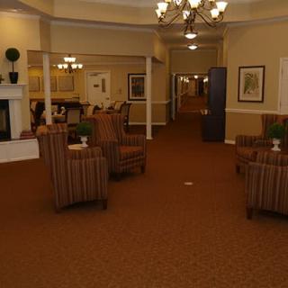A cozy lobby with comfortable seating and warm lighting.