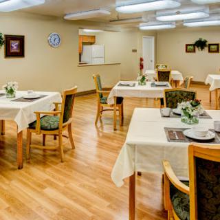 A cozy dining area with neatly arranged tables and elegant decor.