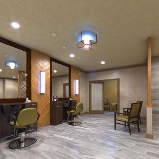 A modern salon interior with stylish chairs, mirrors, and ambient lighting.