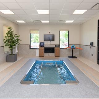 A modern indoor therapy pool designed for rehabilitation and exercise.