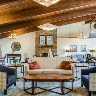 A cozy living room with a vaulted ceiling and elegant decor.