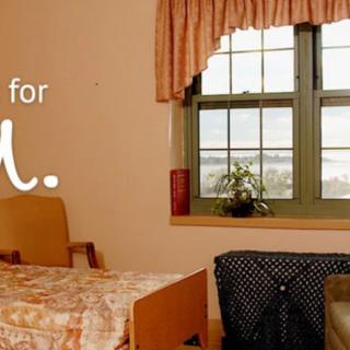 A cozy room with a table set near a window.