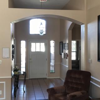 Bright and welcoming home entryway with natural light and elegant decor.