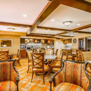 A warm and inviting dining area with elegant furniture and ambient lighting.