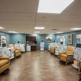 A well-organized dialysis center with treatment chairs and medical equipment.