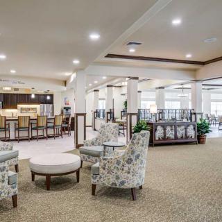 A spacious and modern lobby with comfortable seating areas and elegant lighting.