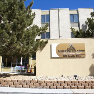 Exterior view of a healthcare building with a sign for a medical rehabilitation center.